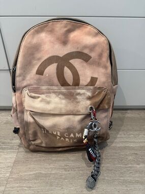 CHANEL Beige Pink Canvas CC Logo Backpack with Charm